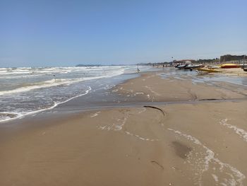 Scenic view of beach against clear sky