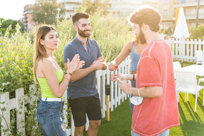 Young couple standing outdoors