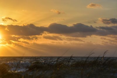 Scenic view of sea against sky during sunset