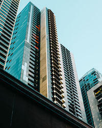 Low angle view of modern buildings against clear sky