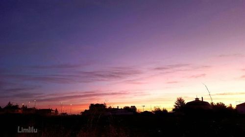 Scenic view of landscape against sky at sunset