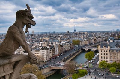 Gargoyle of notre dame cathedral is located at the roof top of the cathedral  