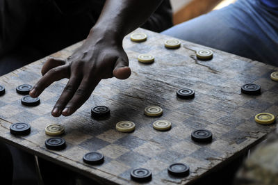 Close-up of man playing board game