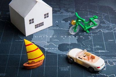 Close-up of toys on map