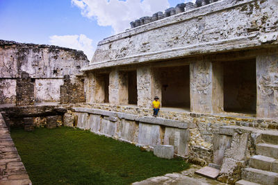 View of old ruin building against cloudy sky