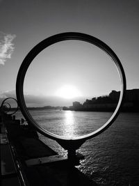 Sunset in front of river seen through circular glass