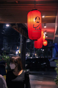 Rear view of illuminated lantern hanging at night