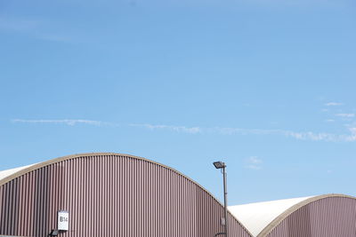 Low angle view of building against blue sky