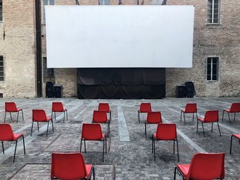 Empty and distanced chairs against movie screen