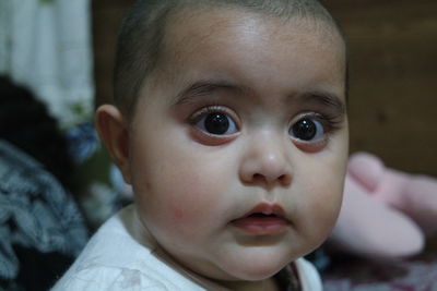 Close-up portrait of cute baby at home