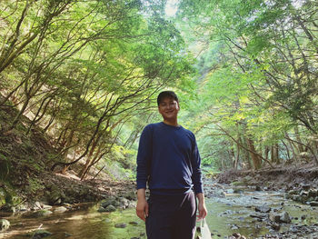 Man standing in forest
