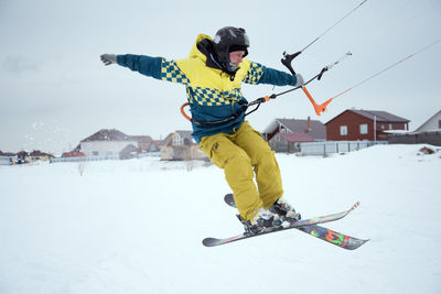 Full length of man skateboarding on snow