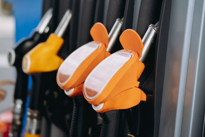 Petrol pump filling fuel nozzles at gas station