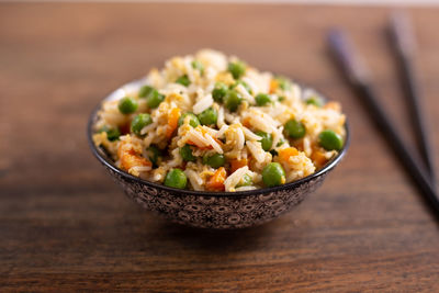 High angle view of cantonese rice in bowl on table