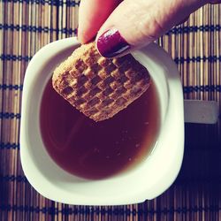 Midsection of person holding ice cream in plate