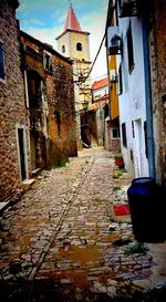 Alley amidst buildings in town