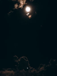 Low angle view of moon against sky at night