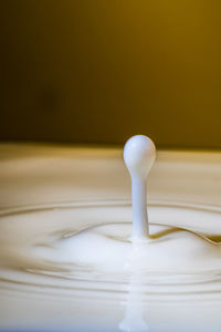 Close-up of water splashing in glass