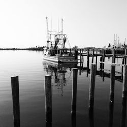 Scenic view of fishing boat against clear sky