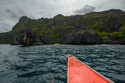 This photo captures the essence of the philippines, with a traditional wooden boat bobbing.