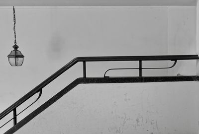 Clothes hanging on railing against sky