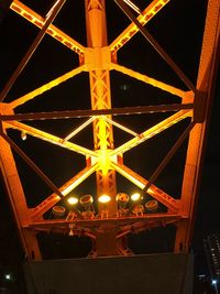 Low angle view of illuminated ceiling at night