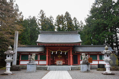 Entrance of temple against building