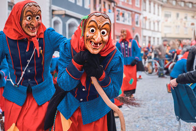 Portrait of people on street in city