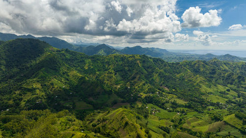 Aerial view of mountain landscape with green hills and farmland. negros, philippines