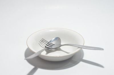 High angle view of empty coffee on table against white background