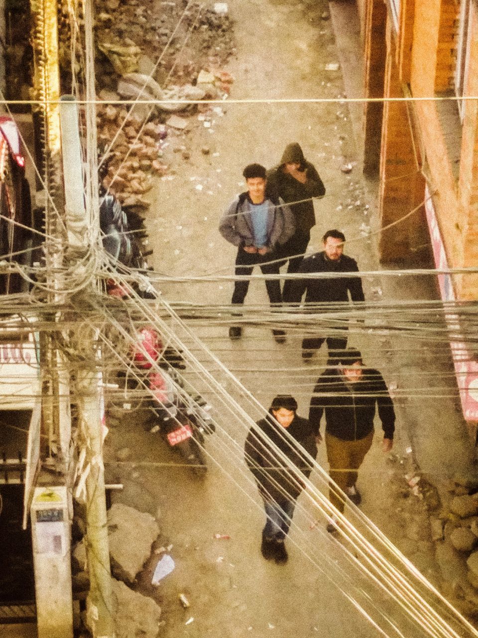 HIGH ANGLE VIEW OF PEOPLE WALKING ON FLOOR