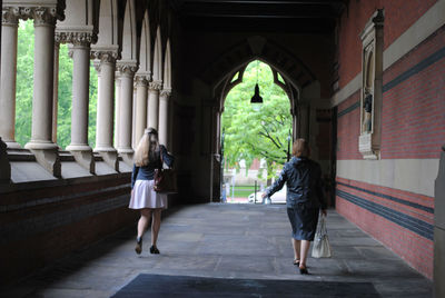 Woman walking on corridor