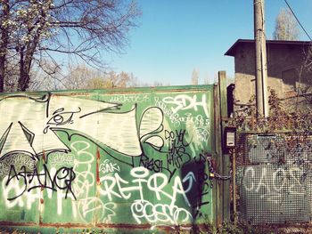 Graffiti on wall against clear sky