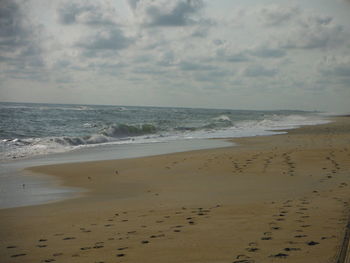 Scenic view of beach against sky