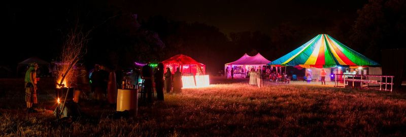 Illuminated lamp post at night