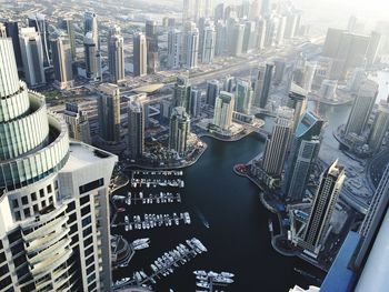 Aerial view of modern city buildings by sea