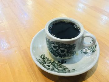 High angle view of coffee cup on table