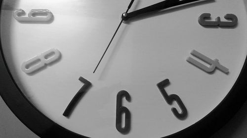 Low angle view of clock on telephone booth