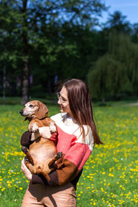 Woman with dog on land