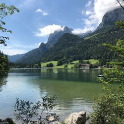 Scenic view of lake and mountains against sky