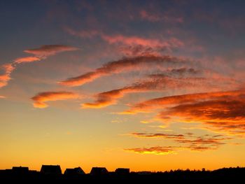 Low angle view of dramatic sky during sunset