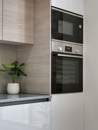 Oven and part of the kitchen in a modern bright interior