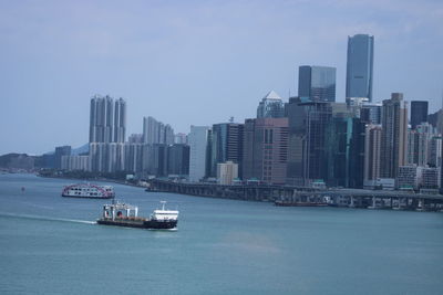 Scenic view of sea and buildings against sky