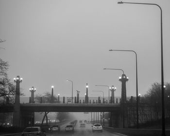 Street lights in city against sky