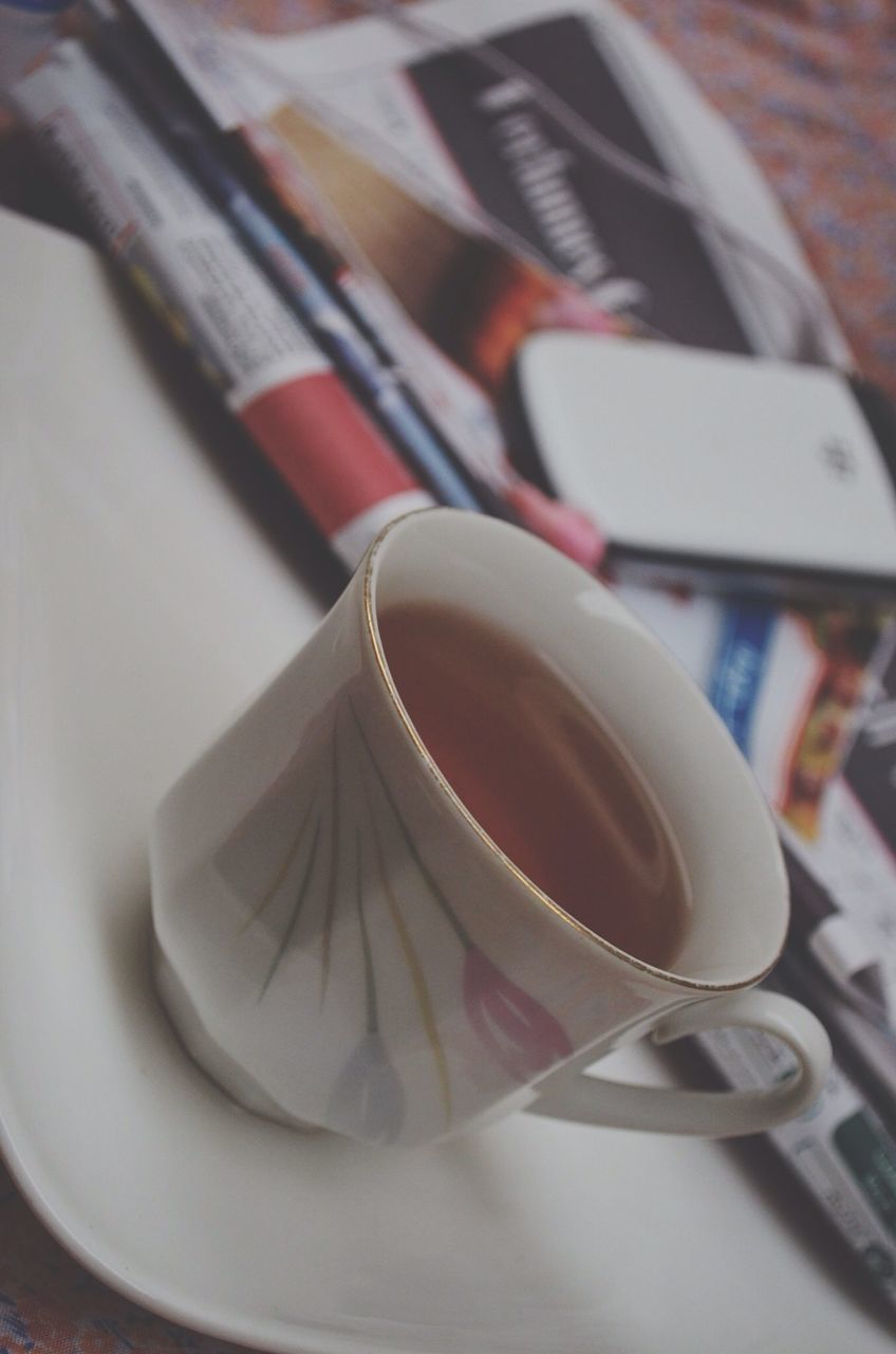 indoors, still life, table, close-up, food and drink, high angle view, coffee cup, spoon, cup, focus on foreground, book, no people, drink, coffee - drink, freshness, selective focus, plate, wood - material, refreshment, fork