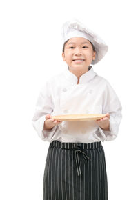 Mid adult man holding ice cream against white background