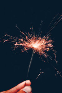 Low angle view of firework display at night