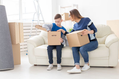 Woman with arms outstretched at home