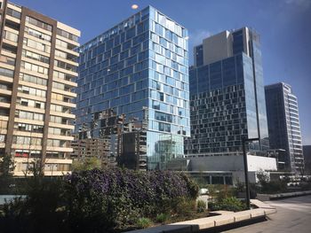 Low angle view of skyscrapers against clear sky