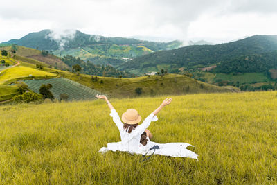 High angle view of woman walking on field